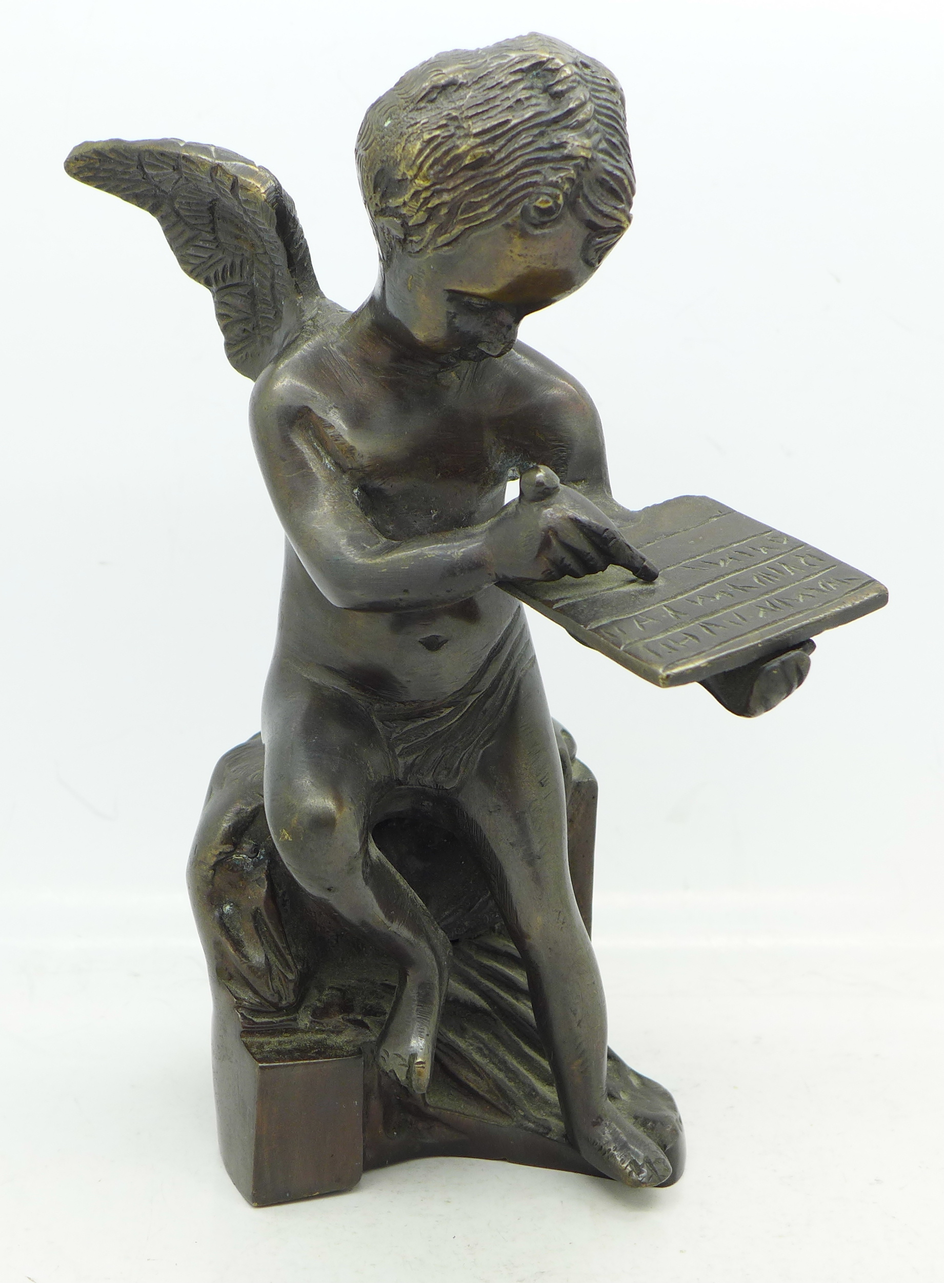 A bronze cherub, 20.