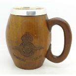 A Royal Indian Air Force white metal and carved wood mug with crest and motto,