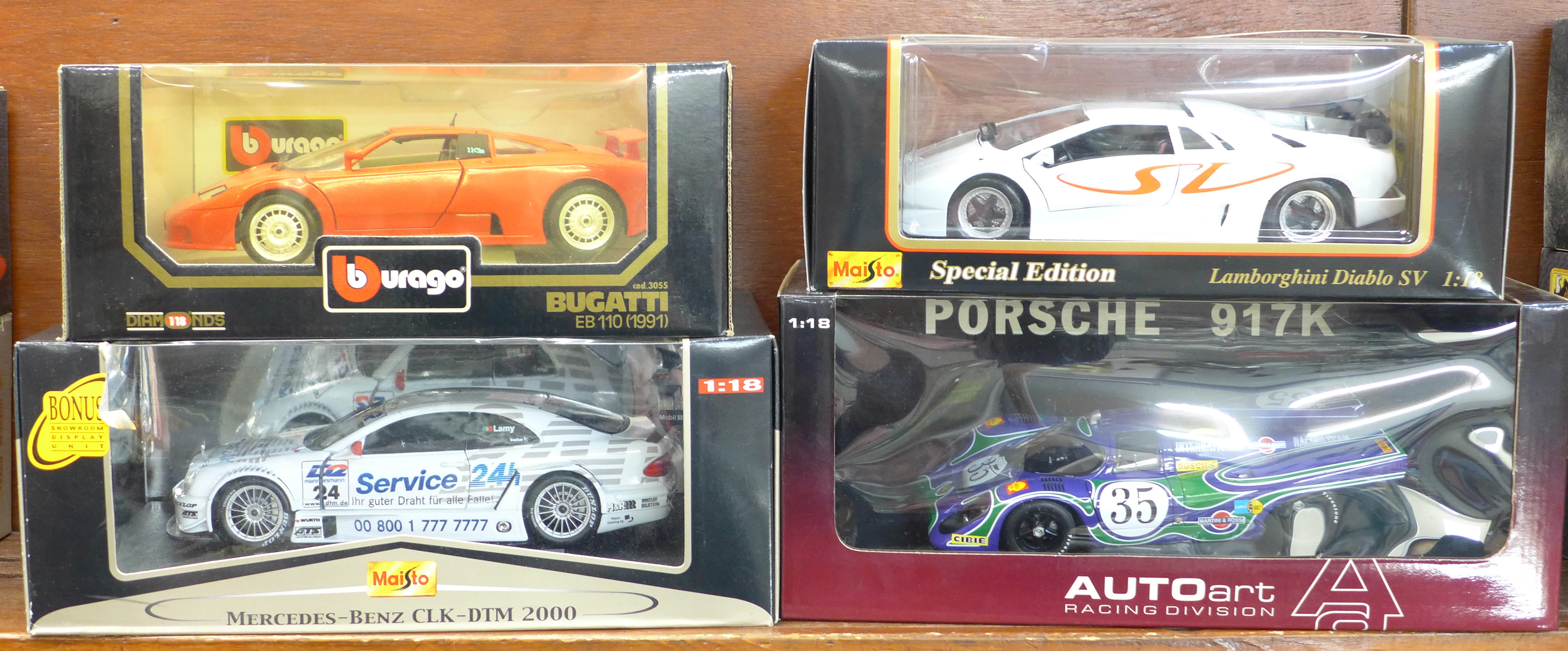 Four 1:18 scale model vehicles; two Maisto, one Auto Art and one Burago, Mercedes-Benz CLK-DTM 2000,