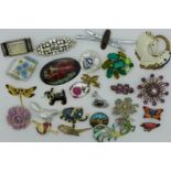 Twenty four costume brooches