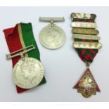 Two WWII medals and a Road Operators Safety Council badge