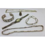 Two silver neck chains, two silver bracelets, a silver wristwatch and a silver thimble,