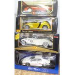 Four 1:18 scale model vehicles; two Maisto, Auto Art and one Burago, Mercedes-Benz 500K,