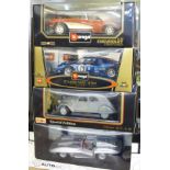 Four 1:18 scale model vehicles; two Burago, one Auto Art and one Maisto, Chevrolet Corvette,