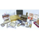 A collection of lighters, cigarette cases, tins, silver plated vestas,