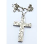 A cross pendant on a silver chain