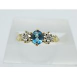 A 9ct gold, diamond and blue stone ring, 1.