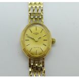 A lady's 9ct gold cased Rotary quartz watch with champagne face and 9ct gold strap, 12.