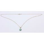 An emerald and diamond pendant on a fine 9ct gold chain, 1.