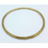 A 9ct gold bangle, hallmark worn, 5.