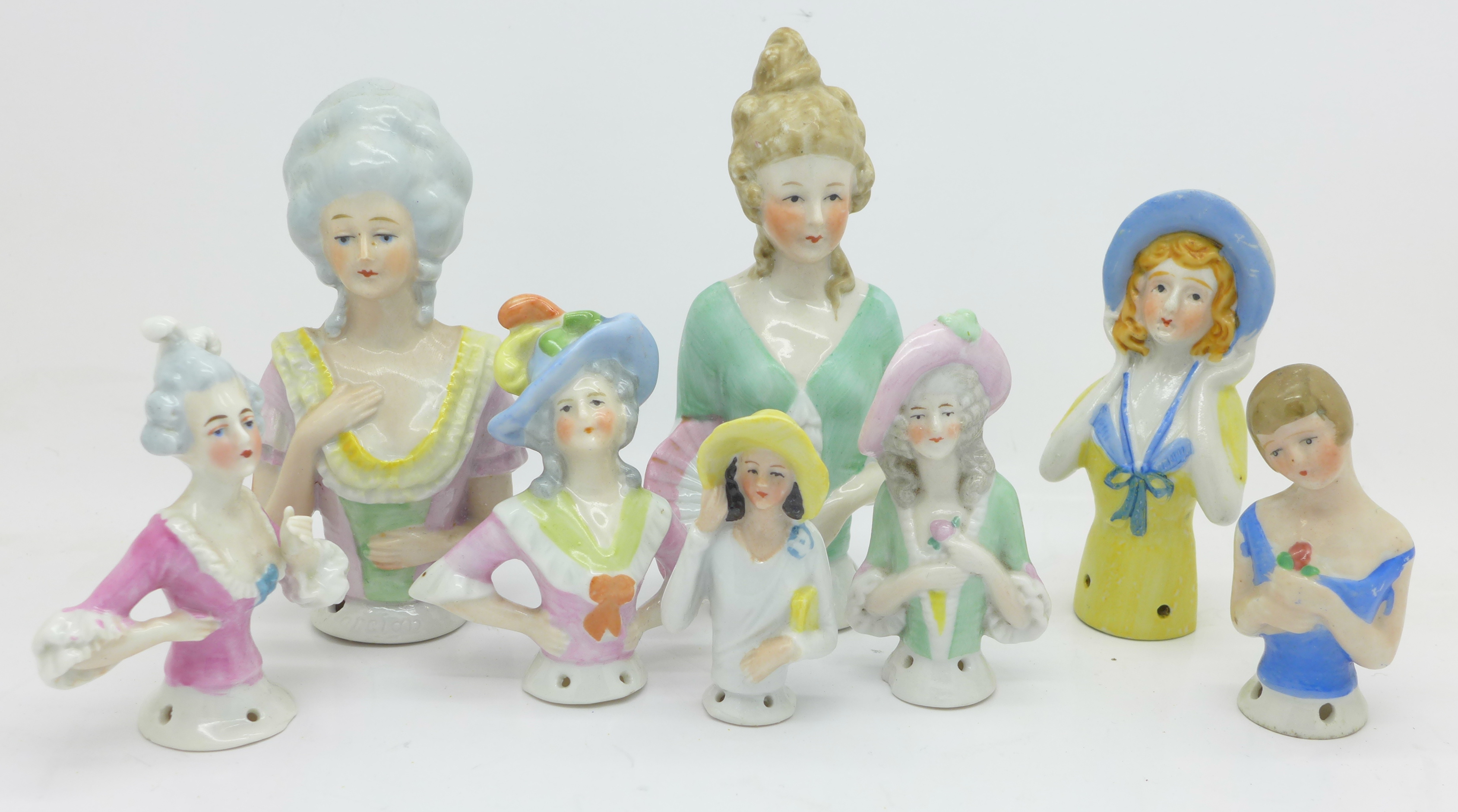 A collection of eight half dolls,