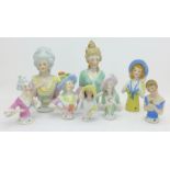 A collection of eight half dolls,