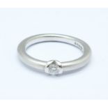 A platinum and diamond solitaire ring, 5.