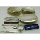 Nine silver items:- letter opener, fork, spoon, napkin ring, toothpick,