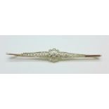 An Edwardian diamond brooch with platinum millegrain setting and gold back and pin,