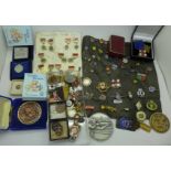 A large collection of badges, stickpins, lapel badges, awards, medals, etc.