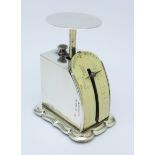 A small hallmarked silver postal scale,