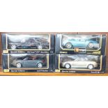 Four 1:18 scale model vehicles; three Maisto and one Burago, Lancia Aurelia, Audi TT Roadster,