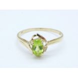 A 9ct gold, peridot and diamond ring, 1g,