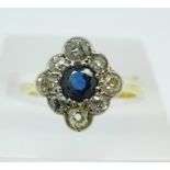 An 18ct gold, platinum, sapphire and diamond cluster ring, 2.8g, O, diamond weight 0.