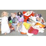 A Sindy doll, two others and clothing, etc.