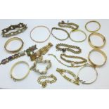 Nineteen mainly Victorian rolled gold bangles and bracelets including gate bracelets and enamelled,