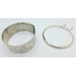 A silver bangle by Charles Horner and a 925 silver bangle