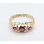 A 9ct gold, ruby and diamond seven stone ring, Chester 1912, 1.