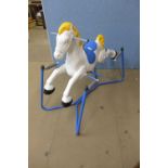 A painted metal child's rocking horse