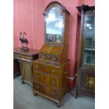 An early 18th Century Queen Anne walnut dome top bookcase, 195cms h, 65cms w,