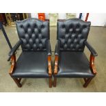 A pair of beech and black leather library chairs