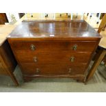 An oak chest of drawers