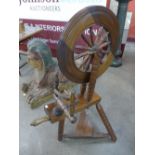 A mahogany spinning wheel