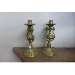 A pair of brass ships gimble candlesticks