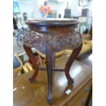 A Chinese carved wooden jardiniere stand