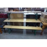 A German folding trestle table and two folding benches