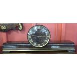 A Hermle mantel clock, with presentation plaque to Lieutenant Eastwood, Ist. Regt.