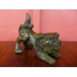 A small oriental bronze dog of foe