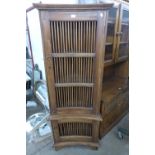 An Indonesian hardwood floor standing corner cupboard