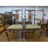 A pair of Queen Anne style mahogany elbow chairs