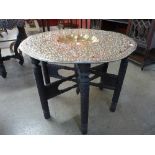 An Indian brass topped folding occasional table