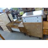 A teak chest of drawers and dressing table