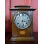 An Edward VII inlaid oak mantel clock