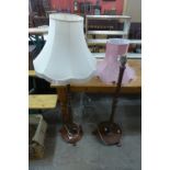 Two mahogany standard lamps