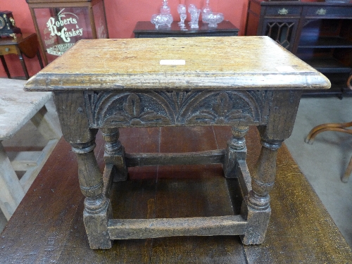 A 17th style carved joined oak coffin stool