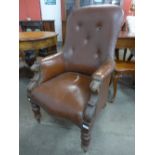 A Victorian mahogany and upholstered armchair