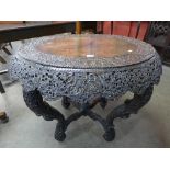 A 19th Century Burmese carved blackwood centre table