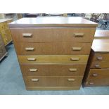 A teak chest of drawers