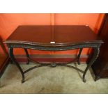 An Edward VII mahogany serpentine serving table