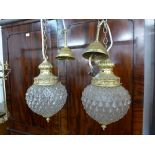 A pair of gilt metal and glass ceiling lights